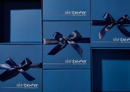 Advent Calendar - Daily Offer Awaits. Blue presents on a dark blue background.